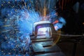 During welding using argon gas, sparks created by welding process produce smoke in a factory Royalty Free Stock Photo
