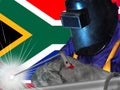 WELDING WORKER WITH THE SOUTH AFRICA FLAG IN THE BACKGROUND Royalty Free Stock Photo