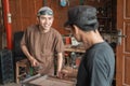 Welding workshop business owners tell their employees to complete work