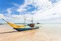 Weligama Beach, Sri Lanka - A traditional fishing boat at the sa