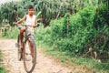 Weligama, Sri Lanka - December 21 , 2017: Little barefoot boy st