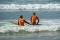 WELIGAMA, SRI LANKA - JANUARY 09 2017: Unidentified couple surfing on a large wave on Weligama beach on the coast of Indian ocean