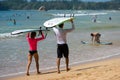 WELIGAMA, SRI LANKA - JANUARY 09 2017: Unidentified couple surfing on a large wave on Weligama beach on the coast of Indian ocean