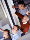 Well be happy to help you. a group of colleagues standing on a staircase. Royalty Free Stock Photo