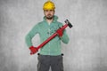 A well-built worker holds a great hammer