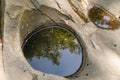 A well carved into the rock by a mountain river, rocks in the carpathians, background, nature Royalty Free Stock Photo