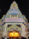 A well decorated exterior and red colored palace like Pandal during Hindu festival of Durga Puja or Navratri for nine days.