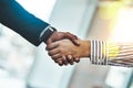 Well done. Closeup shot of two businesspeople shaking hands in an office. Royalty Free Stock Photo