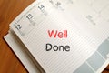 Well done text concept on notebook Royalty Free Stock Photo