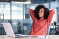 Well done woman completed work project, businesswoman smiling relaxed and looking at laptop screen, female worker with