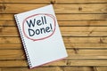 Well done word on notebook Royalty Free Stock Photo