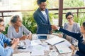 Well done on your outstanding contributions to the company. businesspeople shaking hands during a meeting outdoors.