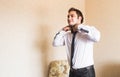 Well dressed business man adjusting his neck tie Royalty Free Stock Photo