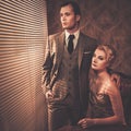 Well-dressed couple in cabinet Royalty Free Stock Photo