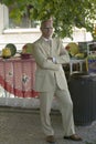 Well dressed man in suit and sun glasses stands in the streets of Sintra, Portugal