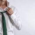 Well dressed man in white shirt get dressed / undressed. Royalty Free Stock Photo