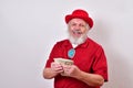 Well dressed old man holding up his money and showing off Royalty Free Stock Photo