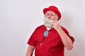 Well dressed old man is kissing his money Royalty Free Stock Photo