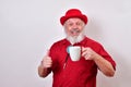 Old man is getting his caffeine jolt Royalty Free Stock Photo