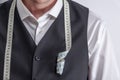 Well dressed tailor in white shirt and black suit vest. Royalty Free Stock Photo