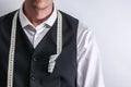 Well dressed tailor in white shirt and black suit vest. Royalty Free Stock Photo