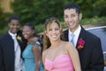 Well-dressed teenage couple outside car portrait Royalty Free Stock Photo