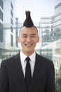 Well-dressed young man with Mohawk smiling, portrait, looking at camera Royalty Free Stock Photo