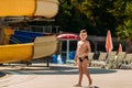 A well-fed six-year-old boy in swimming trunks walks on the territory of the hotel in Turkey. Sunny summer Royalty Free Stock Photo