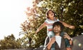 Well fly far together. a father giving his little son a piggyback ride outdoors. Royalty Free Stock Photo