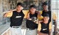 Well give you a run for your money. Portrait of a group of young baseball players standing together in the dugout. Royalty Free Stock Photo