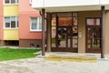 Well-groomed and clean courtyard of a multi-storey building. View of the entrance and the first floor of a residential building.