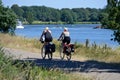 Well, Holland - 06/30/2018: Tourist couple cycling