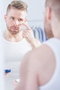 Well kempt man applying cream Royalty Free Stock Photo