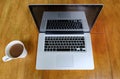 Luxury laptop computer seen on a kitchen table during a coffee break.