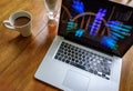 Luxury laptop computer seen on a kitchen table during a coffee break.