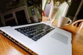 Luxury laptop computer seen on a kitchen table during a coffee break.