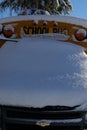 The well-known yellow school bus covered in snow in Vancouver