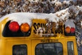 The well-known yellow school bus covered in snow in Vancouver