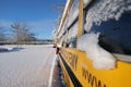 The well-known yellow school bus covered in snow in Vancouver