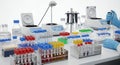 Lab Bench Arrayed with Test Tubes and Research Equipment on a White Surface for Pharmaceutical Development and Medical Royalty Free Stock Photo