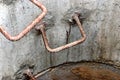 A well made of reinforced concrete rings with water at the bottom. Inside the well. Sewer well from the inside