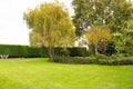 Well-maintained lawn and private gardens seen after the large lawn area was cut. Royalty Free Stock Photo