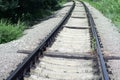 Well-maintained railway track for non-passenger special purposes. Steel rails on concrete sleepers. elongated wooden sleepers are