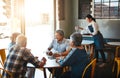 Well never get bored of each other. senior couples on a double date at a cafe.