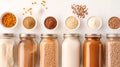 A well-organized display features an array of spices, seeds, and flour stored in glass jars and small bowls