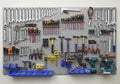 A well-organized tool pegboard featuring a variety of hand tools. Wrenches and spanners are neatly Royalty Free Stock Photo