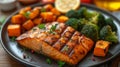 A well-plated dish featuring succulent grilled salmon accompanied by roasted sweet potatoes and steamed broccoli