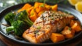 A well-plated dish featuring succulent grilled salmon accompanied by roasted sweet potatoes and steamed broccoli