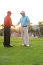 Well played. Two male golfers shaking hands after a friendly round of golf. Royalty Free Stock Photo