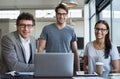 Well take care of all your business needs. Portrait of three businesspeople in the office.